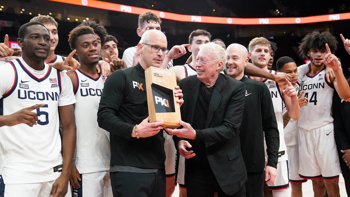 Dan Hurley and UConn receive the Phil Knight Invitational trophy