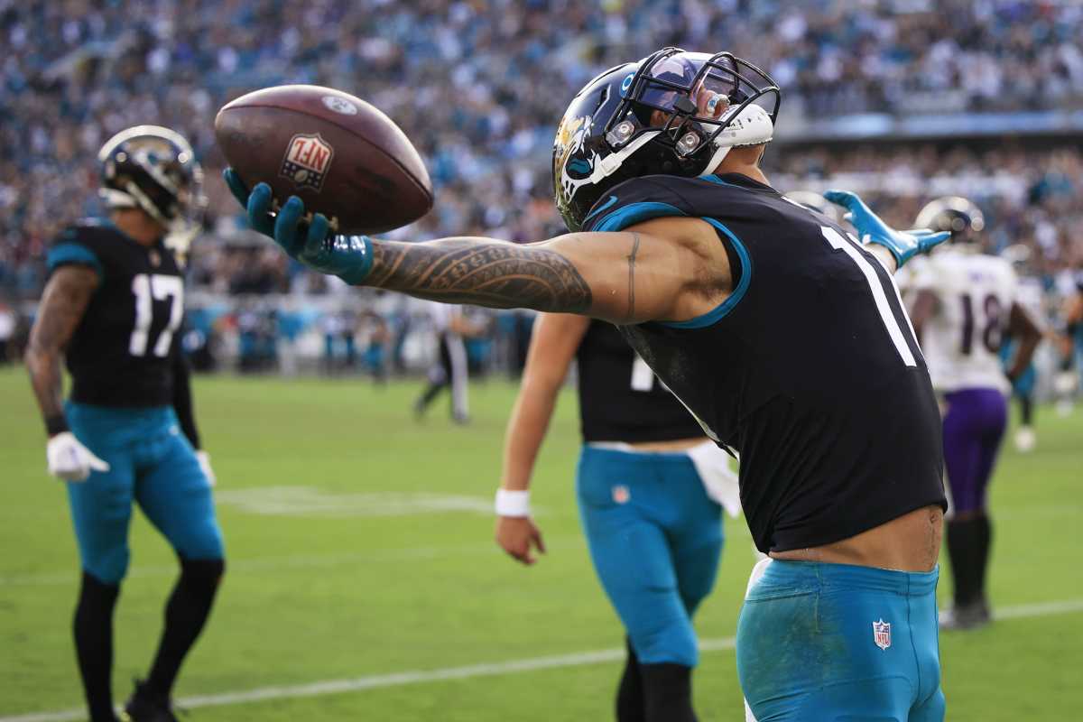Jacksonville Jaguars wide receiver Marvin Jones Jr. (11) reacts to his touchdown pass from quarterback Trevor Lawrence (16) during the fourth quarter of a regular season NFL football matchup Sunday.