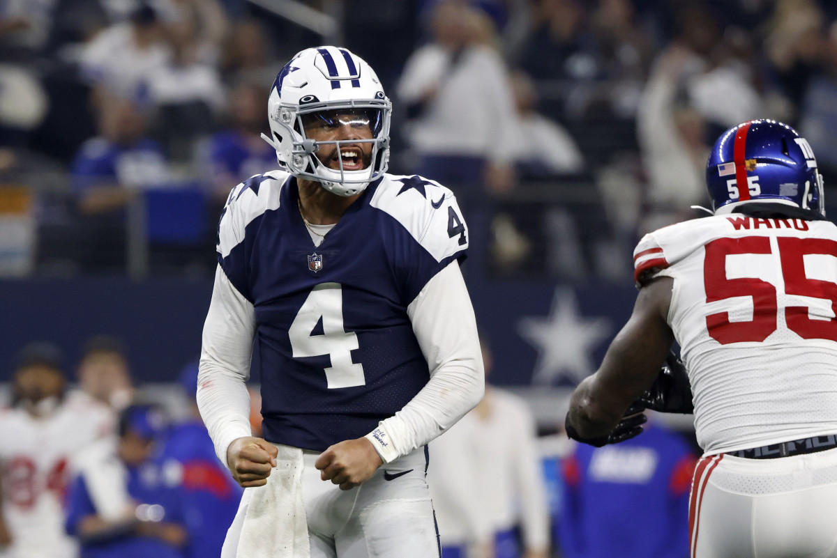 Dallas Cowboys quarterback Dak Prescott (4) celebrates after throwing a touchdown pass against the New York Giants during the second half of an NFL football game Thursday, Nov. 24, 2022, in Arlington, Texas.