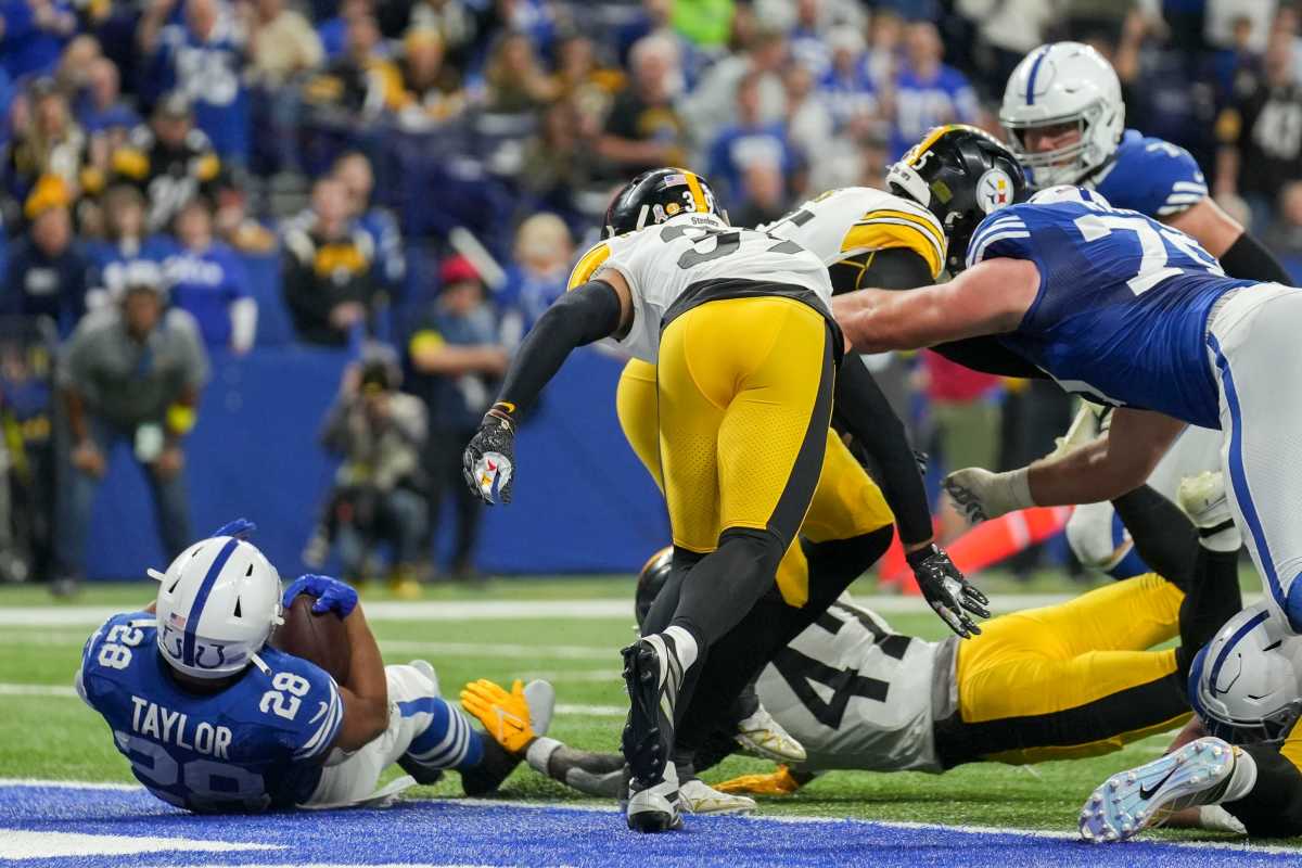 Indianapolis Colts running back Jonathan Taylor (28) falls into the end zone for a touchdown Monday, Nov. 28, 2022, during a game against the Pittsburgh Steelers at Lucas Oil Stadium in Indianapolis.