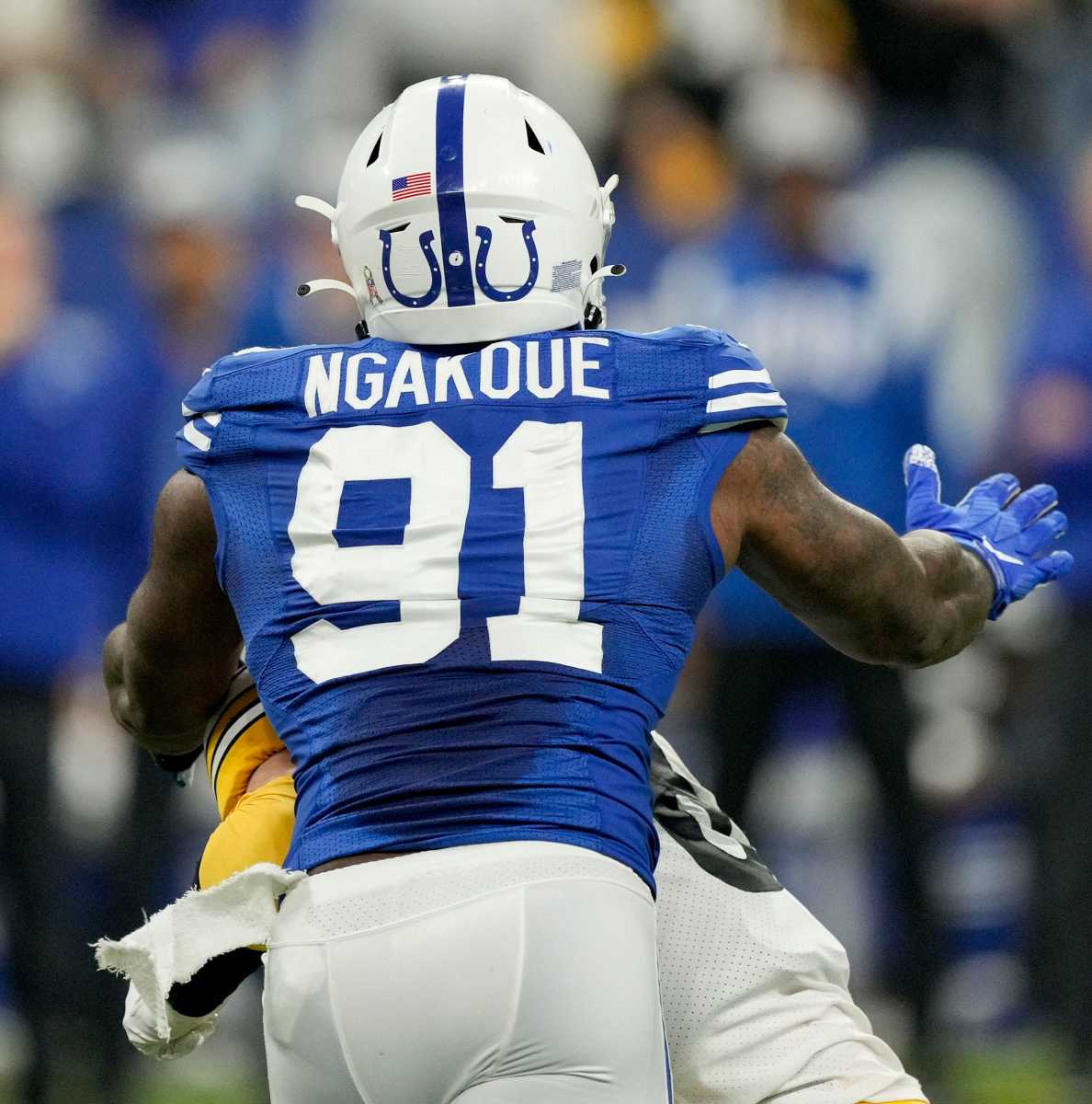 Indianapolis Colts defensive end Yannick Ngakoue (91) moves in to sack Pittsburgh Steelers quarterback Kenny Pickett (8) on Monday, Nov. 28, 2022, during a game against the Pittsburgh Steelers at Lucas Oil Stadium in Indianapolis.