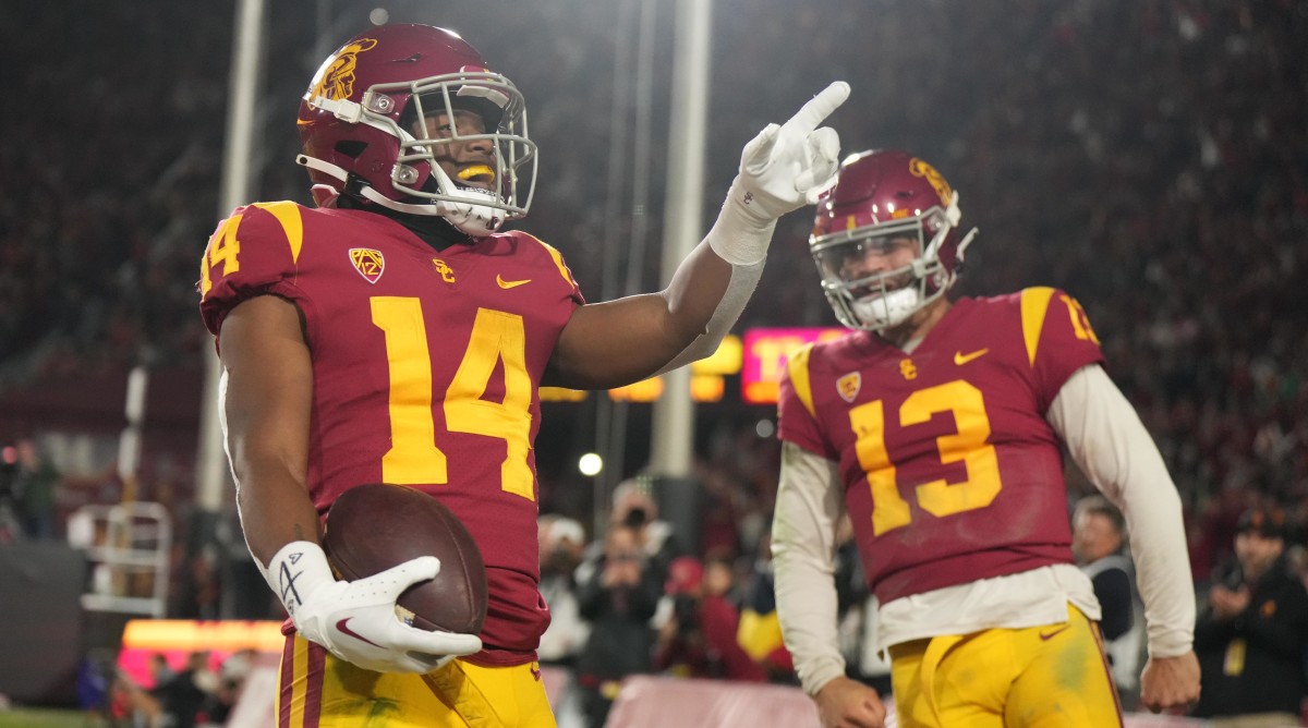 USC running back Raleek Brown (14) celebrates with quarterback Caleb Williams (13)