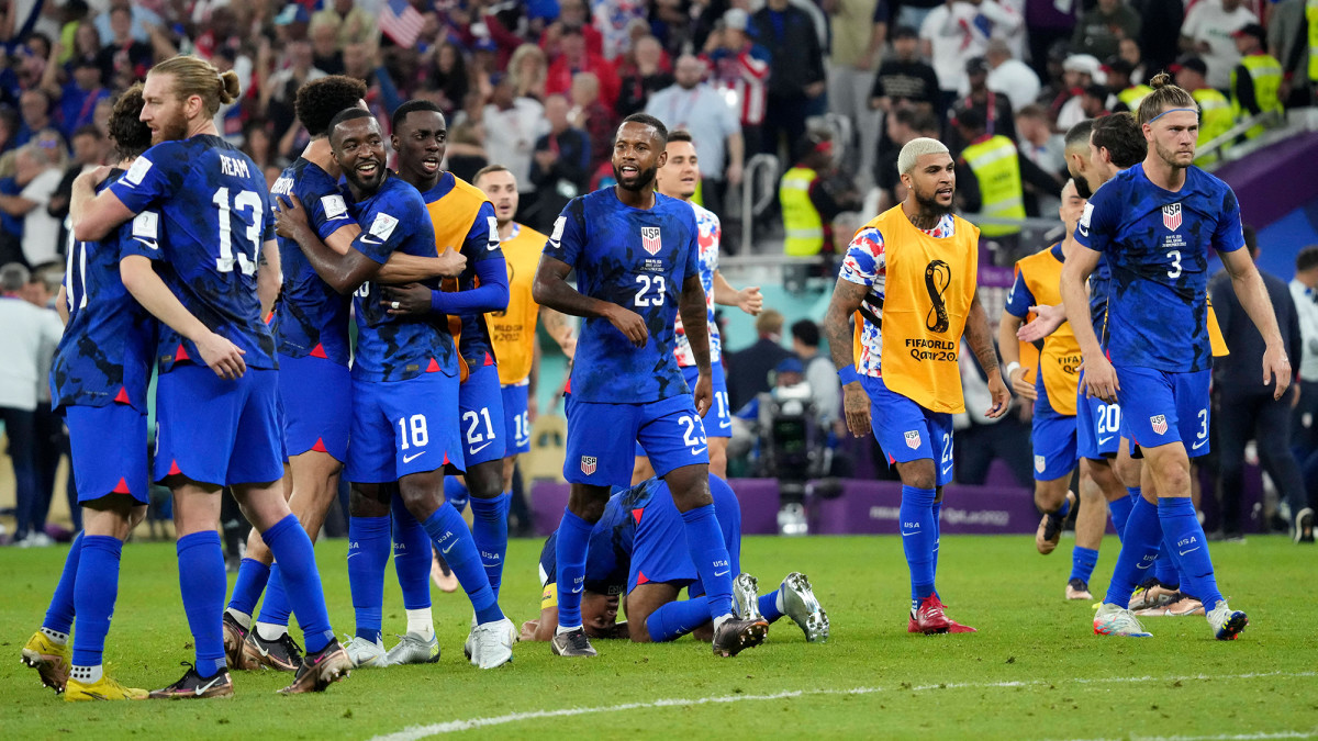 The USMNT celebrates a World Cup win over Iran