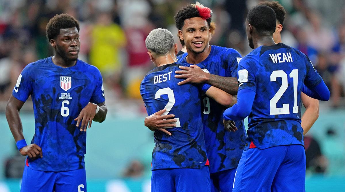 Nov 29, 2022; Doha, Qatar; United States of America midfielder Weston McKennie (8) hugs defender Sergino Dest (2) after forward Christian Pulisic (not pictured) scored a goal against Iran during the first half of a group stage during the 2022 World Cup at Al Thumama Stadium.