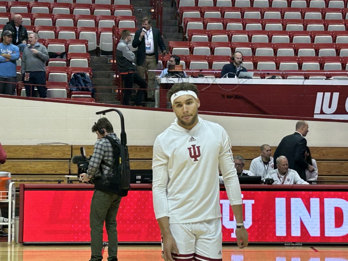 Race Thompson warms up donning his now famous headband ahead of the UNC game.