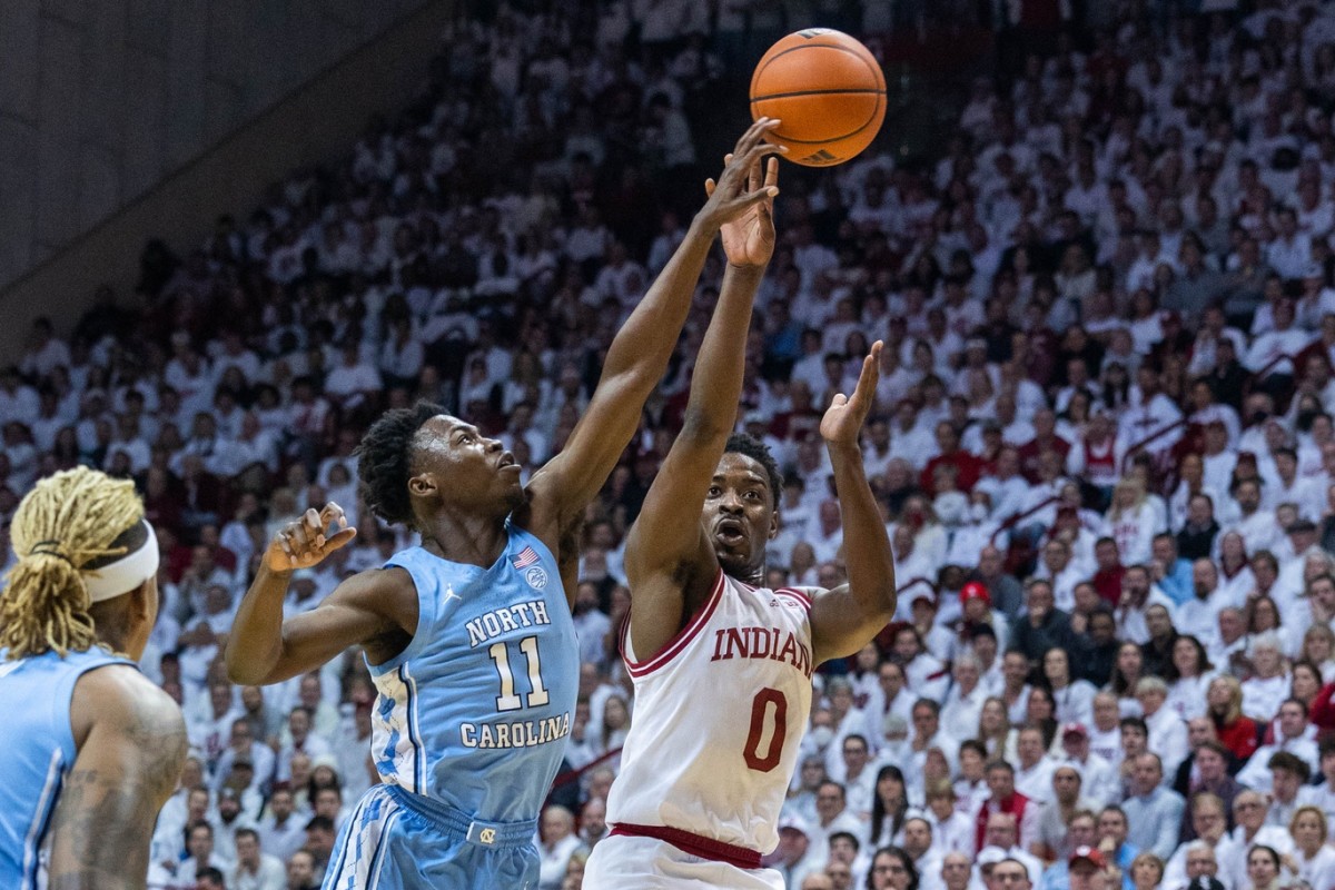 Indiana Hoosiers guard Xavier Johnson (0) shoots the ball while North Carolina Tar Heels guard D'Marco Dunn (11) defends in the first half at Simon Skjodt Assembly Hall.