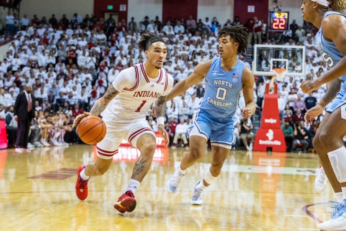 Indiana Hoosiers guard Jalen Hood-Schifino (1) dribbles the ball while North Carolina Tar Heels guard Seth Trimble (0) defends in the first half at Simon Skjodt Assembly Hall.