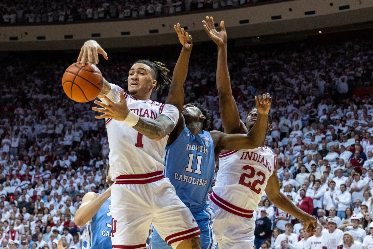 Indiana Hoosiers guard Jalen Hood-Schifino (1) rebounds the ball while North Carolina Tar Heels guard D'Marco Dunn (11) defends in the second half at Simon Skjodt Assembly Hall.