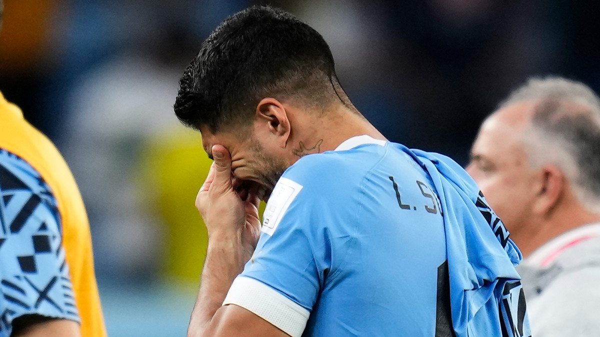 Luis Suarez cries after Uruguay is dumped out of the World Cup
