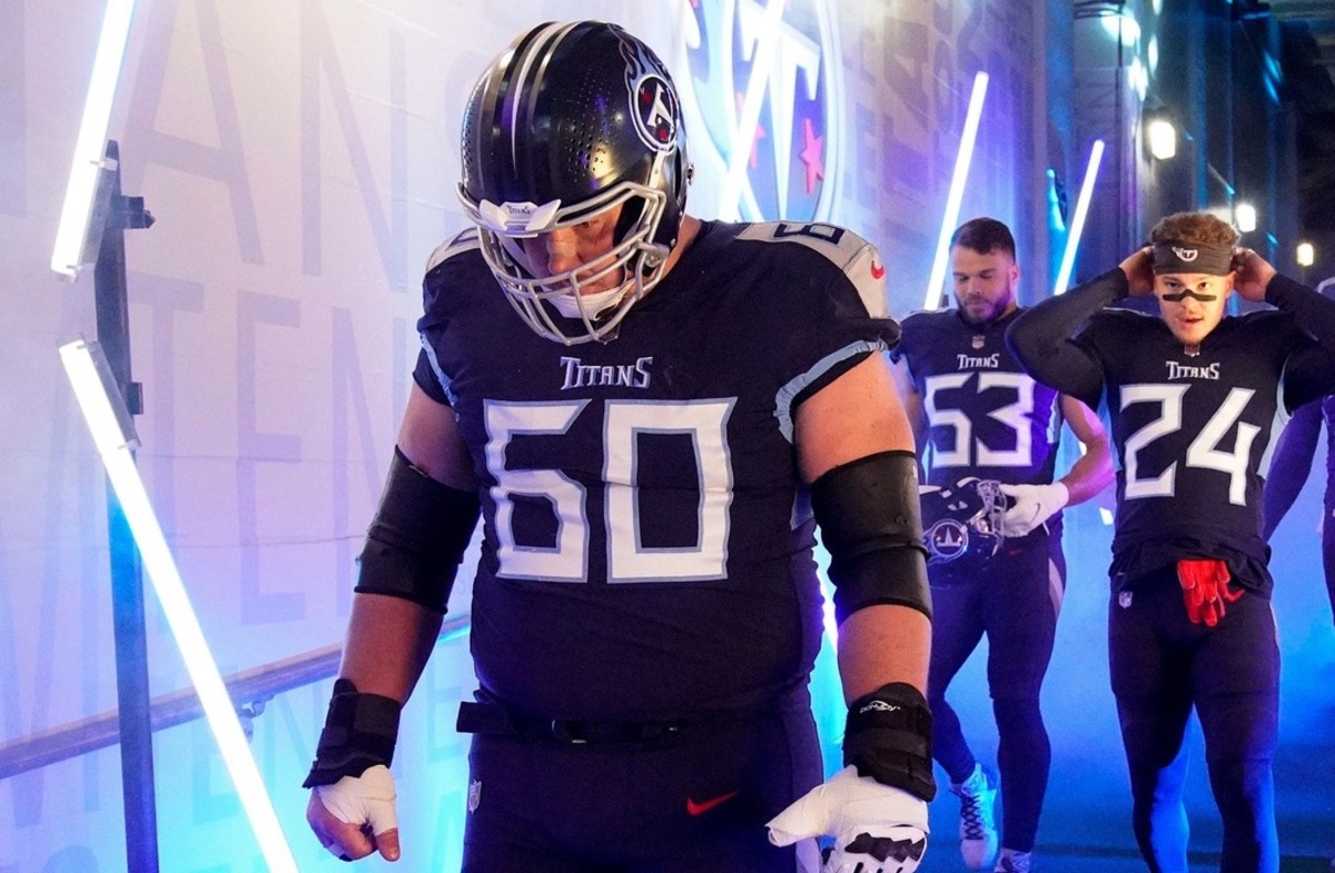 Tennessee Titans center Ben Jones (60) and other teammates head to the field to face the Bengals during the AFC Divisional playoff game at Nissan Stadium Saturday, Jan. 22, 2022 in Nashville, Tenn.