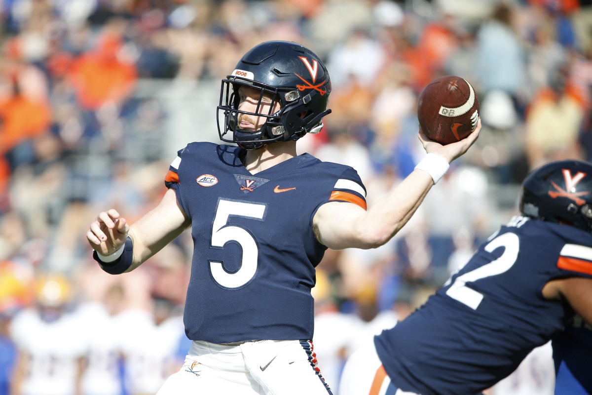 Charlottesville, Virginia, USA; Virginia Cavaliers quarterback Brennan Armstrong (5) throws the ball against the Pittsburgh Panthers during the first half at Scott Stadium.