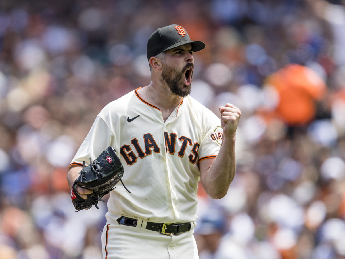 Giants lefthander Carlos Rodon reacts after getting a striking out against the Dodgers.