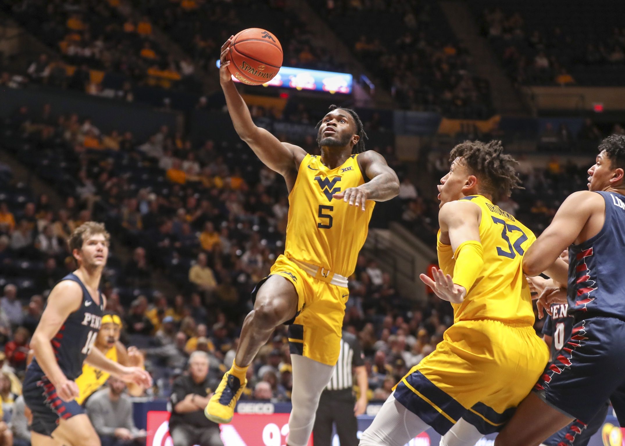 Spread & Over/Under Predictions for WVU at Xavier Sports Illustrated