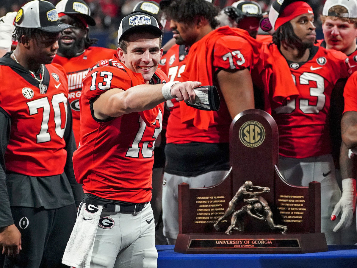 Stetson Bennett with the SEC championship trophy