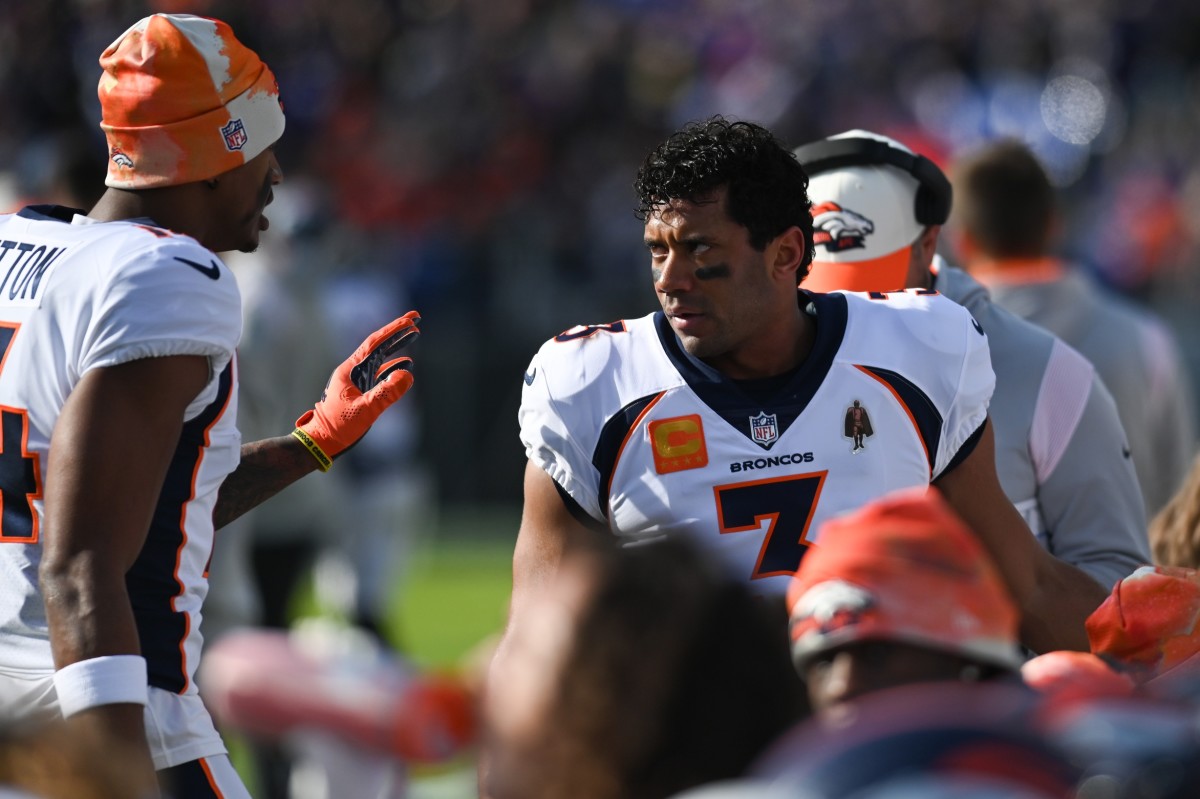 Denver Broncos quarterback Russell Wilson (3) speaks with wide receiver Courtland Sutton (14) on the sidelines during the first quarter against the Baltimore Ravens at M&T Bank Stadium.