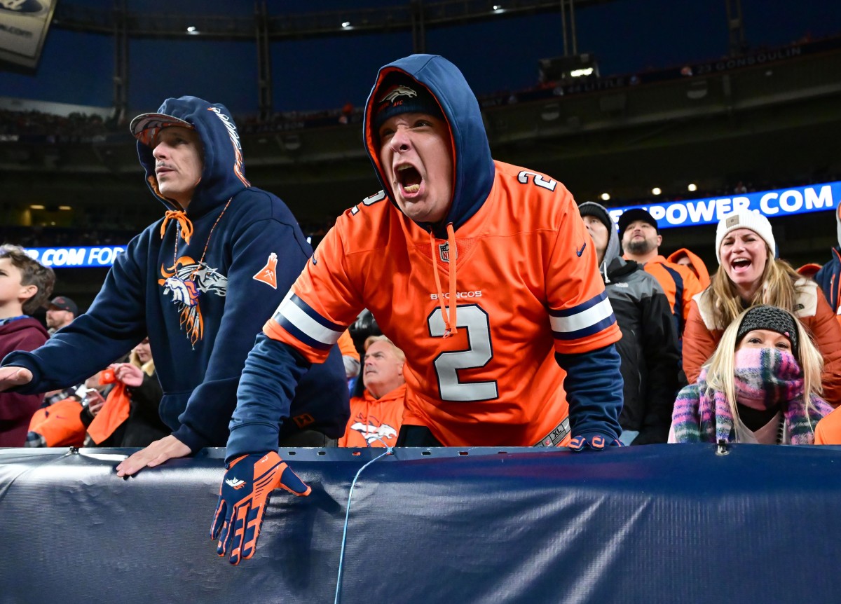 Denver Broncos fans react to play against the Las Vegas Raiders in the fourth quarter at Empower Field at Mile High.