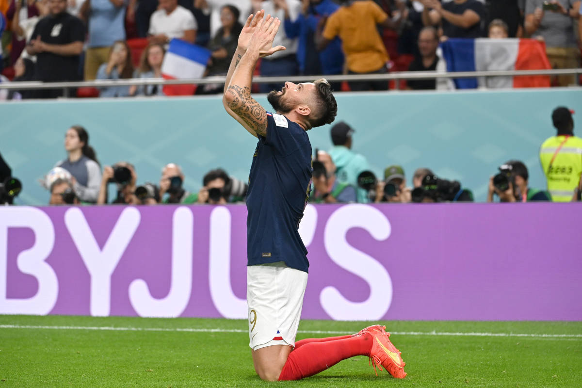 Olivier Giroud pictured celebrating after scoring his 52nd goal for France in December 2022