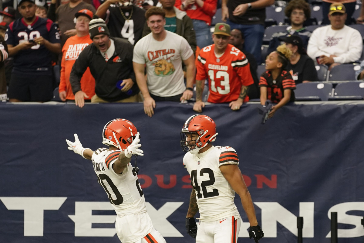 Tony Fields and Greg Newsome celebrate Fields' touchdown in the Browns' win over the Texans