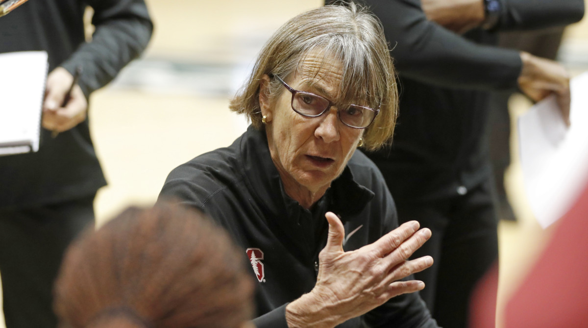 Stanford head coach Tara VanDerveer instructs her team between quarters during an NCAA college basketball game.