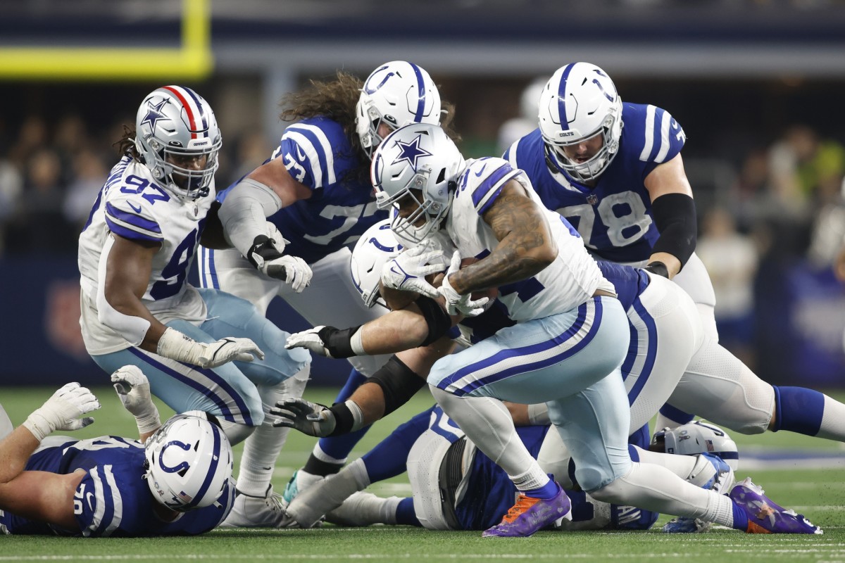 Dec 4, 2022; Arlington, Texas, USA; Dallas Cowboys defensive end Sam Williams (54) recovers a fumble against the Indianapolis Colts in the fourth quarter at AT&T Stadium.