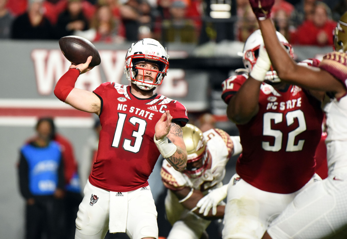 Raleigh, North Carolina, USA; North Carolina State Wolfpack quarterback Devin Leary (13) throws a pass during the first half against the Florida State Seminoles at Carter-Finley Stadium