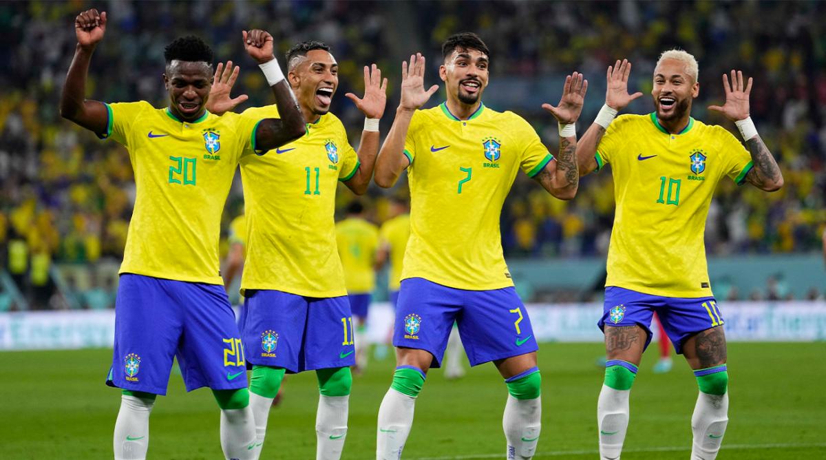 Brazil’s Neymar, from right, celebrates with team mates Lucas Paqueta, Raphinha and Vinicius Junior after scoring his side’s second goal during the World Cup round of 16 soccer match between Brazil and South Korea, at the Stadium 974 in Al Rayyan, Qatar, Monday, Dec. 5, 2022.