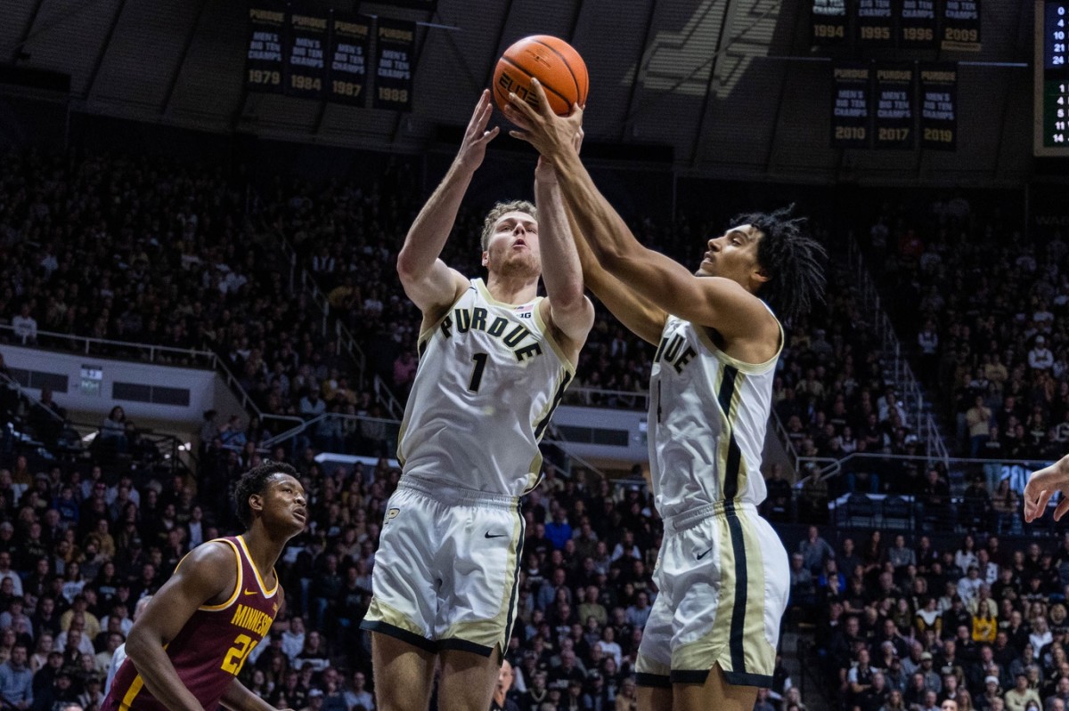Dec 4, 2022; West Lafayette, Indiana, USA; Purdue Boilermakers forward Caleb Furst (1) and forward Trey Kaufman-Renn (4) rebound the ball in the first half against the Minnesota Golden Gophers at Mackey Arena.