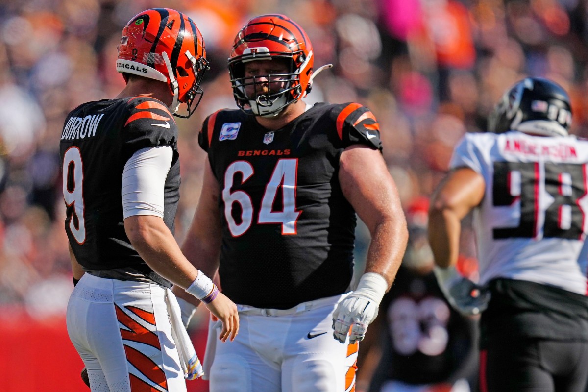 Cincinnati Bengals quarterback Joe Burrow (9) shares words with center Ted Karras (64) Ofer being sacked in the third quarter of the NFL Week 7 game between the Cincinnati Bengals and the Atlanta Falcons at Paycor Stadium in downtown Cincinnati on Sunday, Oct. 23, 2022. The Bengals won 35-17. Mandatory Credit: Sam Greene-The Enquirer Atlanta Falcons At Cincinnati Bengals Nfl Week 7© Sam Greene / USA TODAY NETWORK