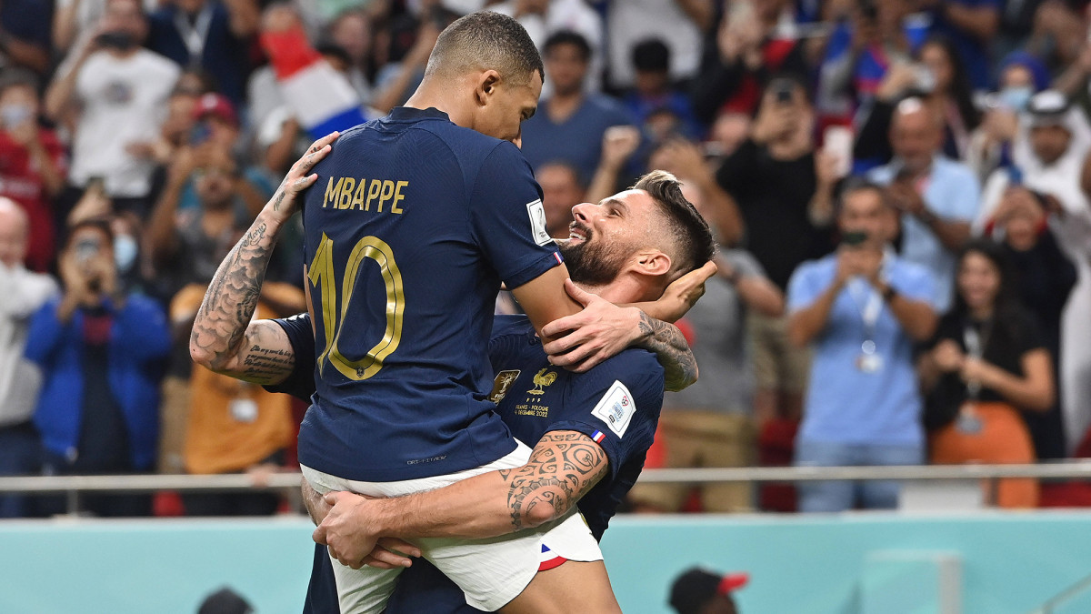 Kylian Mbappe and Olivier Giroud celebrate a France goal at the World Cup