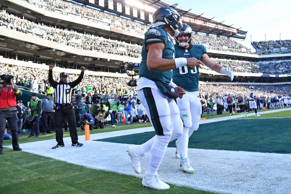 Dec 4, 2022; Philadelphia, Pennsylvania, USA; Philadelphia Eagles quarterback Jalen Hurts (1) celebrates his touchdown with tight end Jack Stoll (89) against the Tennessee Titans during the second quarter at Lincoln Financial Field.
