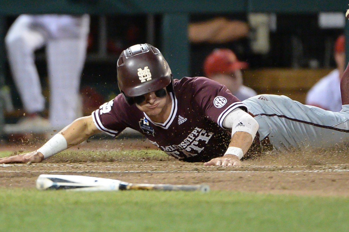 Mississippi State outfielder Jake Mangum slides into home plate during the 2019 College World Series.