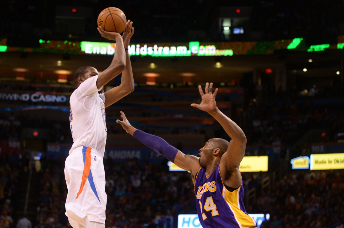 Apr 11, 2016; Oklahoma City, OK, USA; Oklahoma City Thunder forward Kevin Durant (35) drives to the basket over Los Angeles Lakers forward Kobe Bryant (24) during the third quarter at Chesapeake Energy Arena. Mandatory Credit: Mark D. Smith-USA TODAY Sports