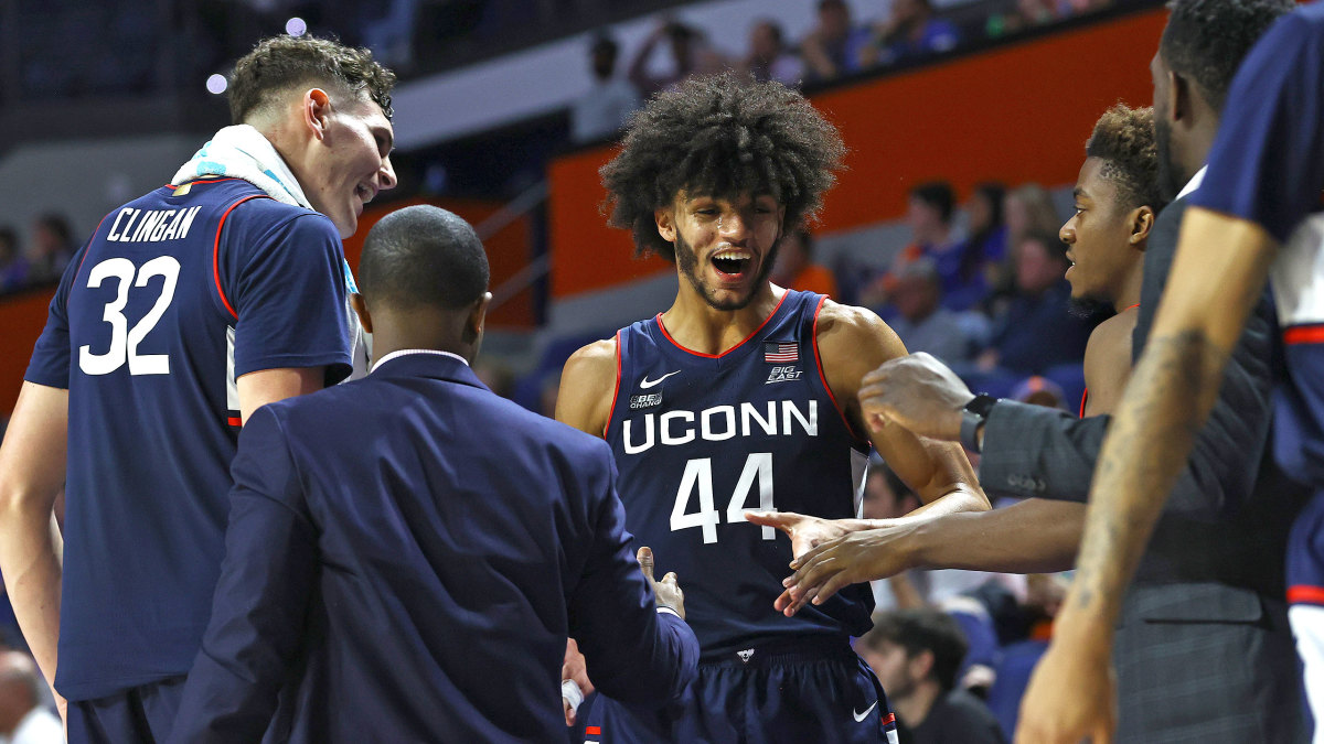 UConn’s Andre Jackson Jr. smiles with teammates
