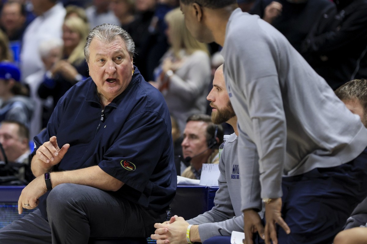Dec 3, 2022; Cincinnati, Ohio, USA; West Virginia Mountaineers head coach Bob Huggins reacts from the bench in the game against the Xavier Musketeers in the second half at Cintas Center.