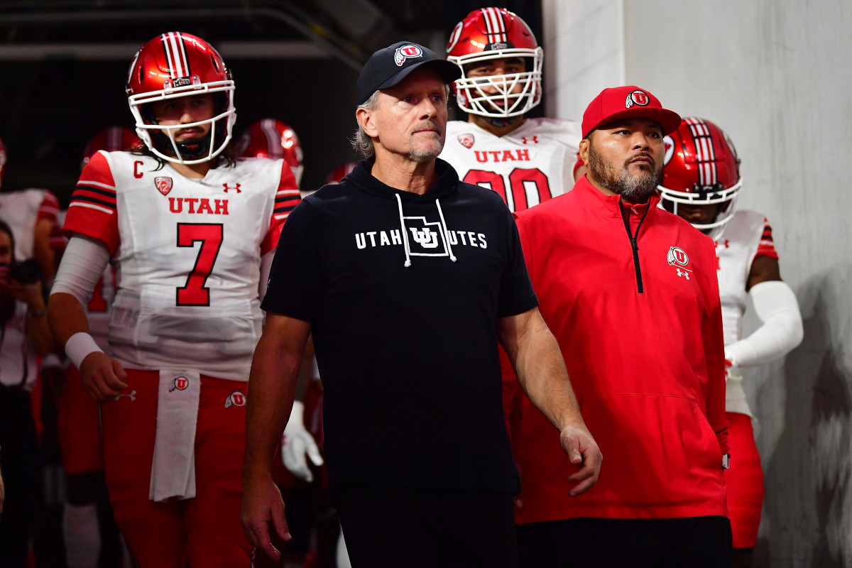Las Vegas, NV, USA; Utah Utes head coach Kyle Whittingham and quarterback Cameron Rising (7) are introduced before playing against the Southern California Trojans in the PAC-12 Football Championship at Allegiant Stadium.
