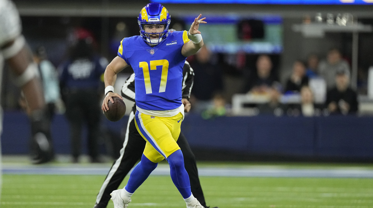 Rams quarterback Baker Mayfield rolls out vs. the Raiders.