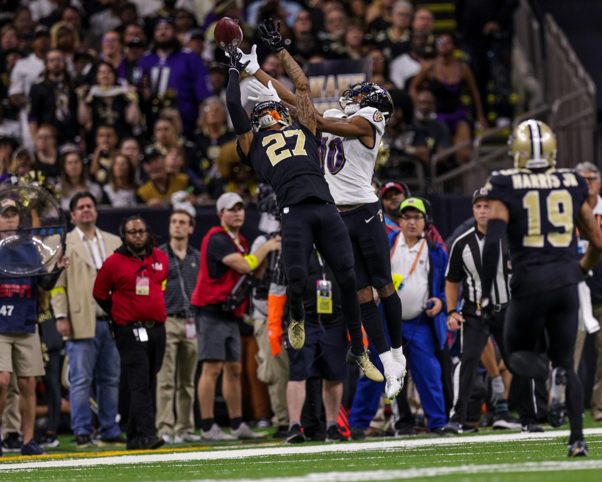 New Orleans Saints cornerback Alontae Taylor (27) breaks up a pass intended for Baltimore Ravens receiver Demarcus Robinson (10). Mandatory Credit: Stephen Lew-USA TODAY Sports