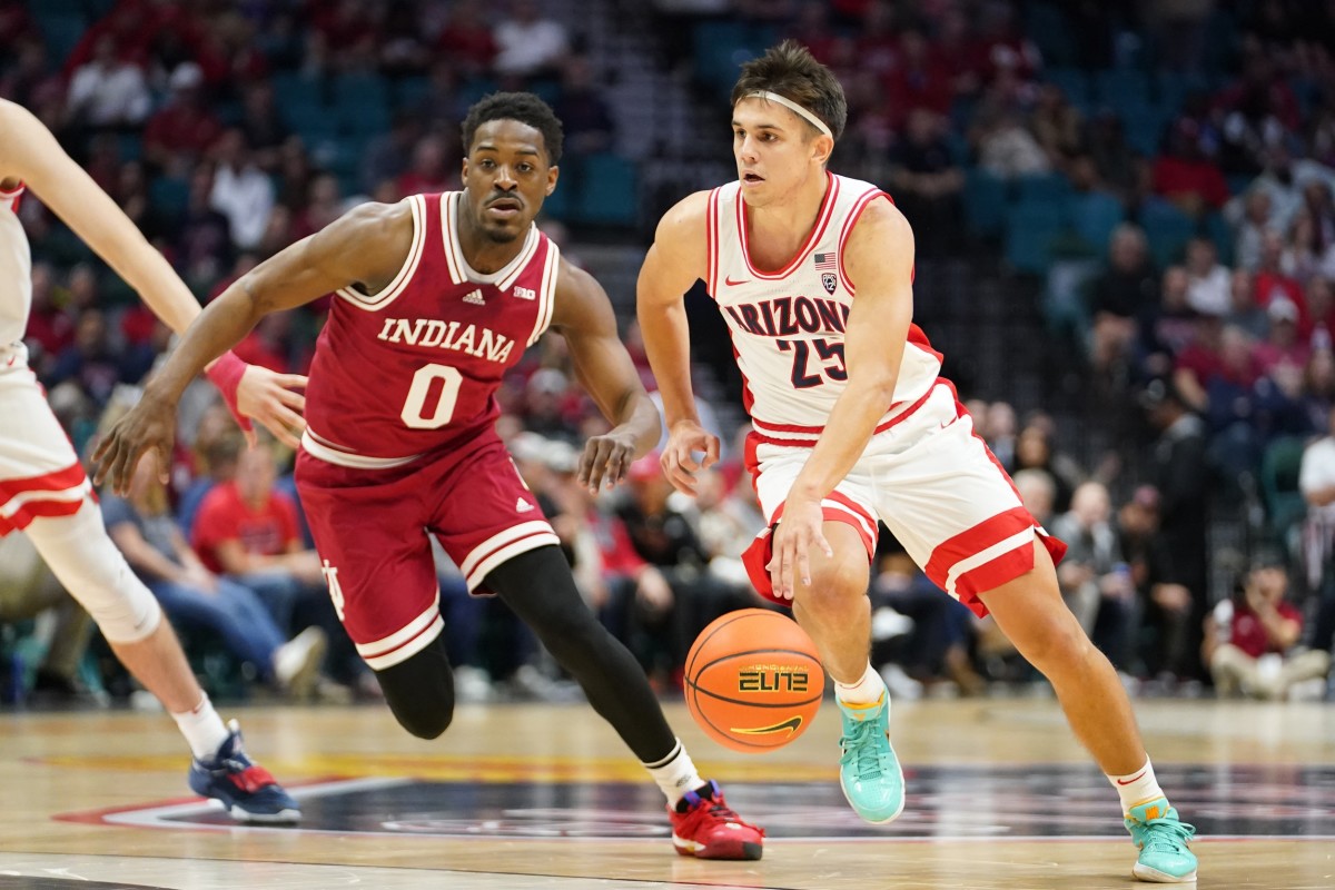 Arizona Wildcats guard Kerr Kriisa (25) drives the ball against Indiana Hoosiers guard Xavier Johnson (0) during the first half at MGM Grand Garden Arena.