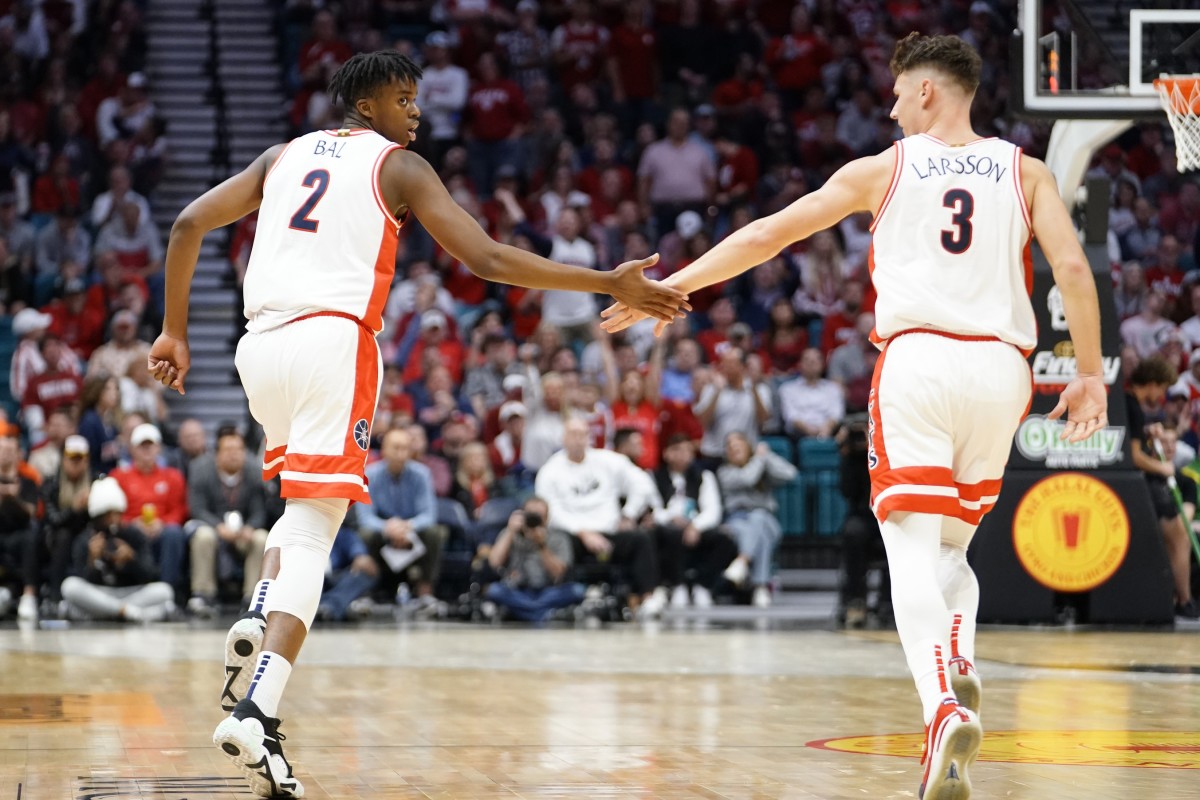 Arizona Wildcats guard Adama Bal (2) celebrates with Pelle Larsson (3) after scoring a three point basket against the Indiana Hoosiers during the first half at MGM Grand Garden Arena.