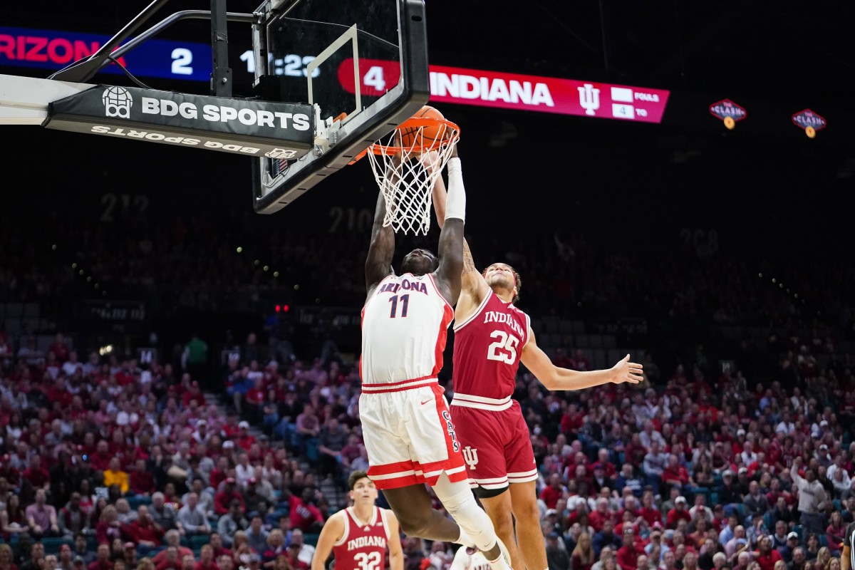 Arizona Wildcats center Oumar Ballo (11) scores a layup against Indiana Hoosiers forward Race Thompson (25) during the first half at MGM Grand Garden Arena.
