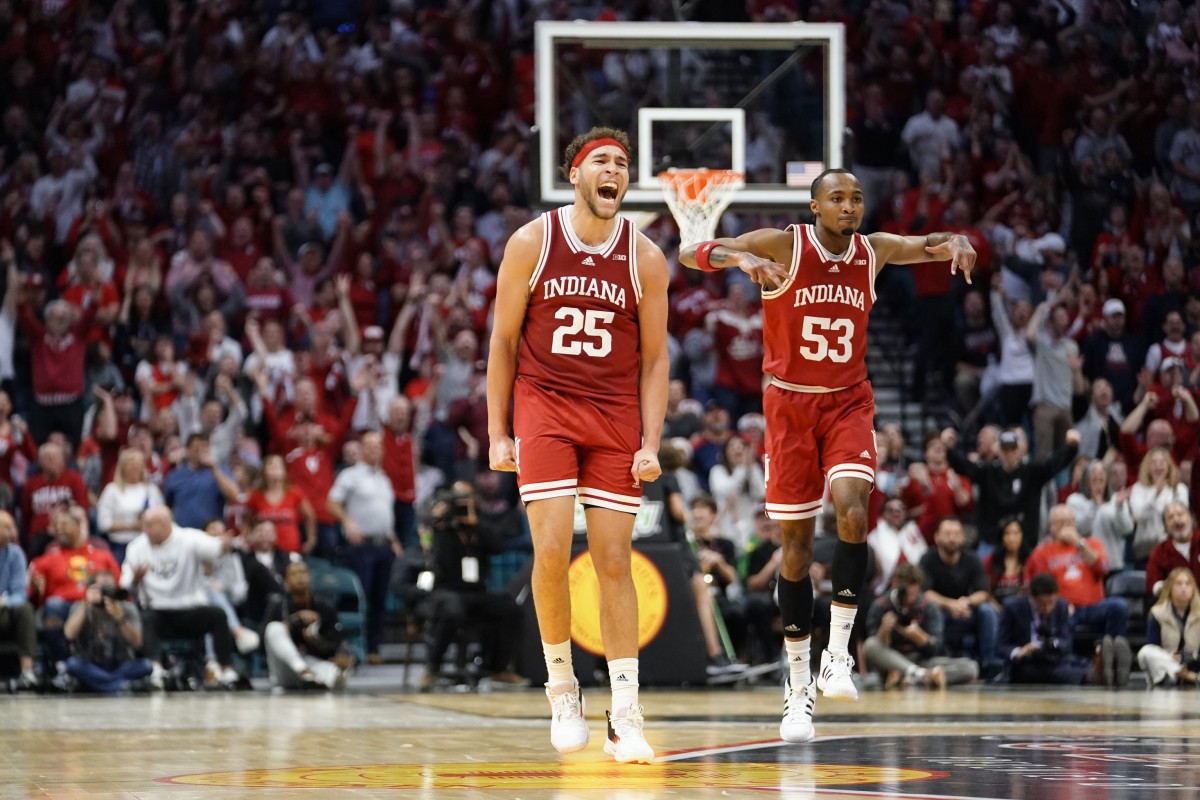 Indiana Hoosiers forward Race Thompson (25) and guard Tamar Bates (53) react after a score against the Arizona Wildcats during the second half at MGM Grand Garden Arena.