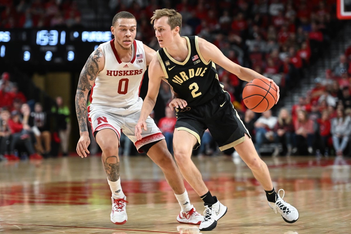 Dec 10, 2022; Lincoln, Nebraska, USA; Purdue Boilermakers guard Fletcher Loyer (2) drives against Nebraska Cornhuskers guard C.J. Wilcher (0) in the second half at Pinnacle Bank Arena.