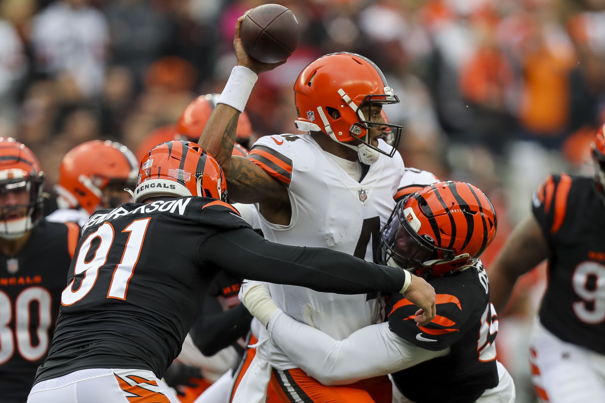 Dec 11, 2022; Cincinnati, Ohio, USA; Cleveland Browns quarterback Deshaun Watson (4) throws a pass against Cincinnati Bengals defensive end Trey Hendrickson (91) and defensive end Joseph Ossai (58) in the first half at Paycor Stadium. Mandatory Credit: Katie Stratman-USA TODAY Sports