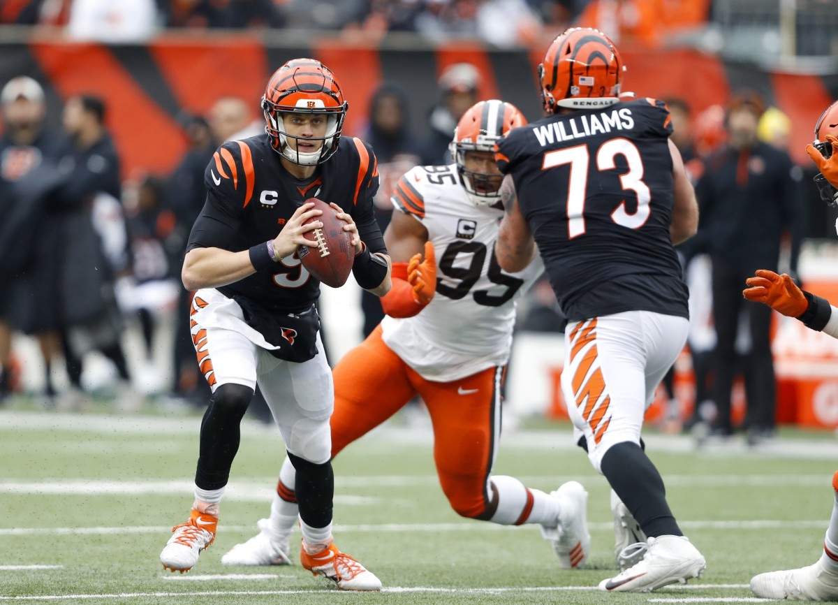 Dec 11, 2022; Cincinnati, Ohio, USA; Cincinnati Bengals quarterback Joe Burrow (9) runs the ball while under pressure during the second quarter against the Cleveland Browns at Paycor Stadium. Mandatory Credit: Joseph Maiorana-USA TODAY Sports