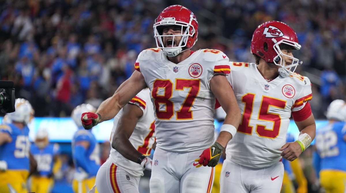 Chiefs tight end Travis Kelce (87) celebrates with quarterback Patrick Mahomes (15) after scoring on a 17-yard touchdown reception against the Chargers.