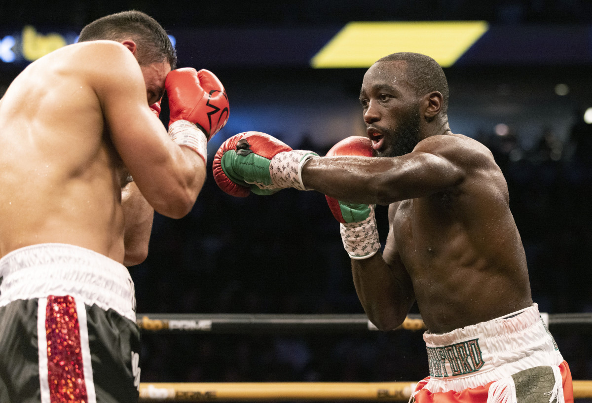 Terence Crawford, right, fights David Avanesyan during a World Boxing Organization welterweight world title boxing match on Saturday, Dec. 10, 2022, in Omaha, Neb. Crawford knocked out Avanesyan in the sixth round