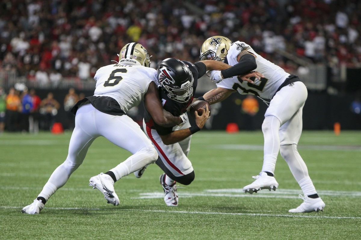 Sep 11, 2022; New Orleans Saints safety Marcus Maye (6) strips the ball from Falcons quarterback Marcus Mariota (1) as safety Tyrann Mathieu (32) looks to make a tackle. Mandatory Credit: Brett Davis-USA TODAY Sports
