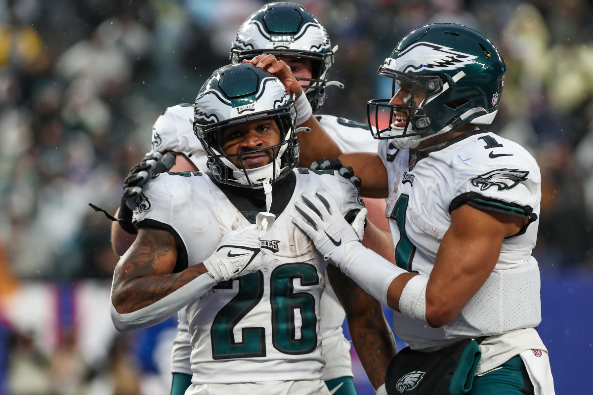 Philadelphia Eagles running back Miles Sanders (26) celebrates with quarterback Jalen Hurts (1) after scoring a touchdown against the New York Giants during the fourth quarter at MetLife Stadium.