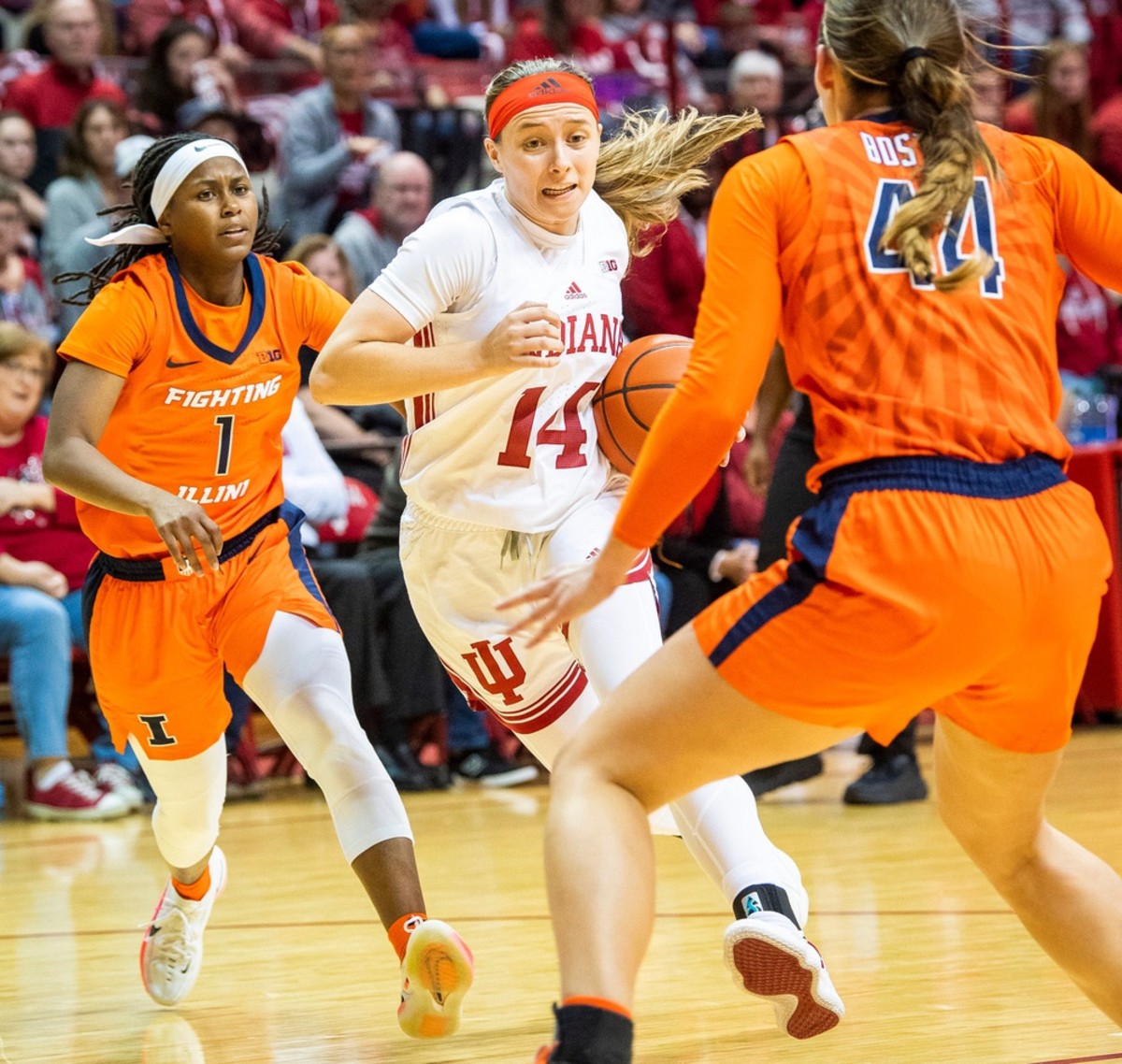 Indiana's Sara Scalia (14) drives on Illinois' Kendall Bostic (44) during the second half of the Indiana versus Illinois women's basketball game at Simon Skjodt Assembly Hall on Sunday, Dec. 4, 2022.