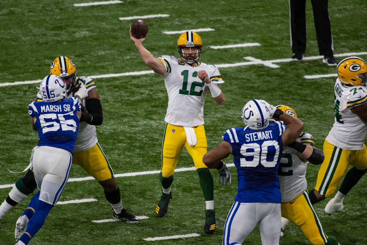 Nov 22, 2020; Indianapolis, Indiana, USA; Green Bay Packers quarterback Aaron Rodgers (12) passes the ball in the first half against the Indianapolis Colts at Lucas Oil Stadium.